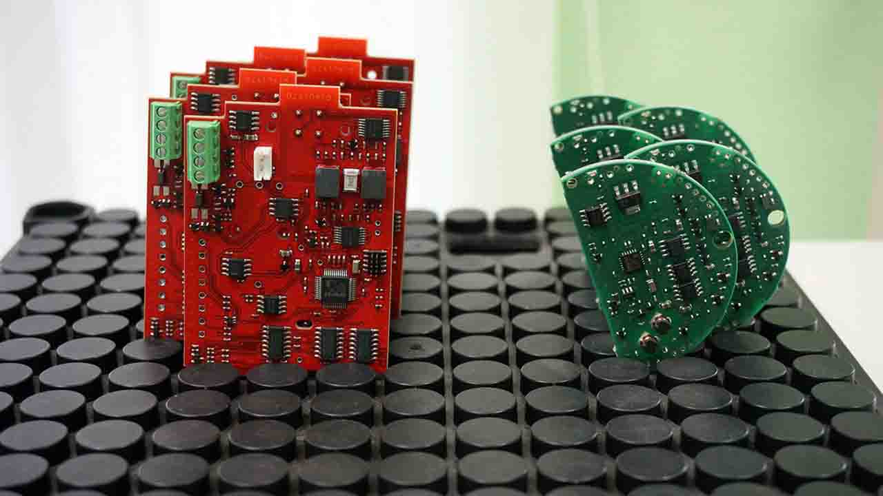 Batch of PCBs arranged after rework and continuity testing